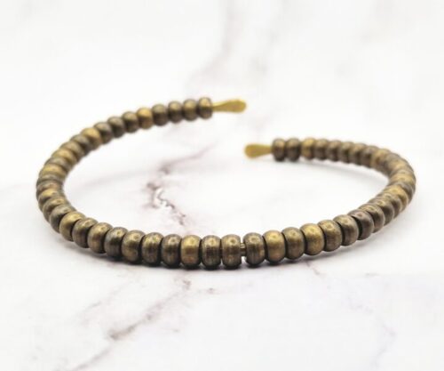 Mei’s Tibetan Copper Wrapped armband van koper in goud